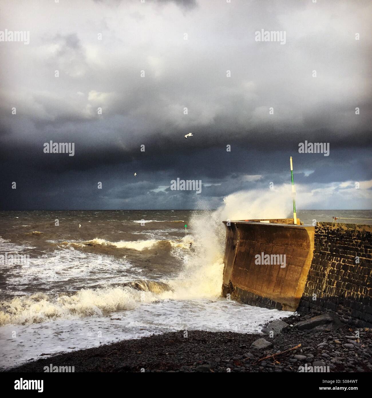 Stormy weather, waves breaking, Aberaeron, West Wales Stock Photo