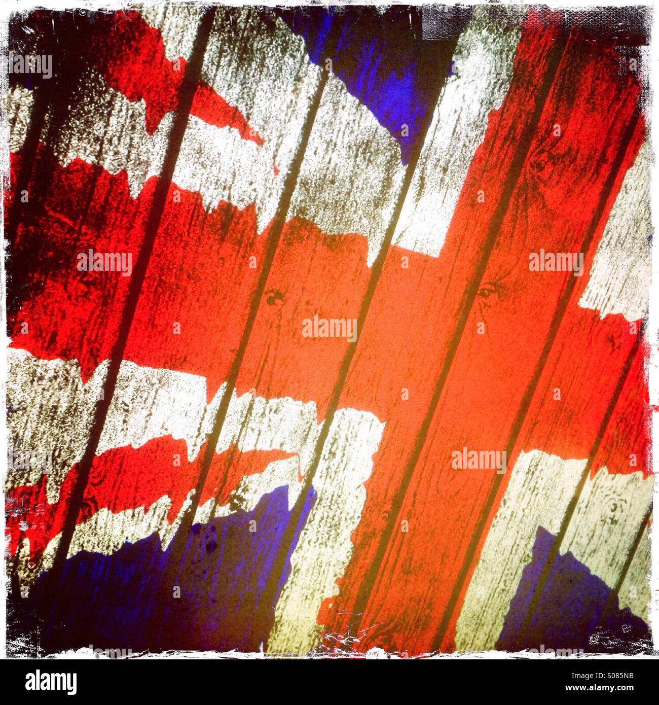 British Union Jack flag on a rough textured wooden fence - Smartphone Captured Stock Image