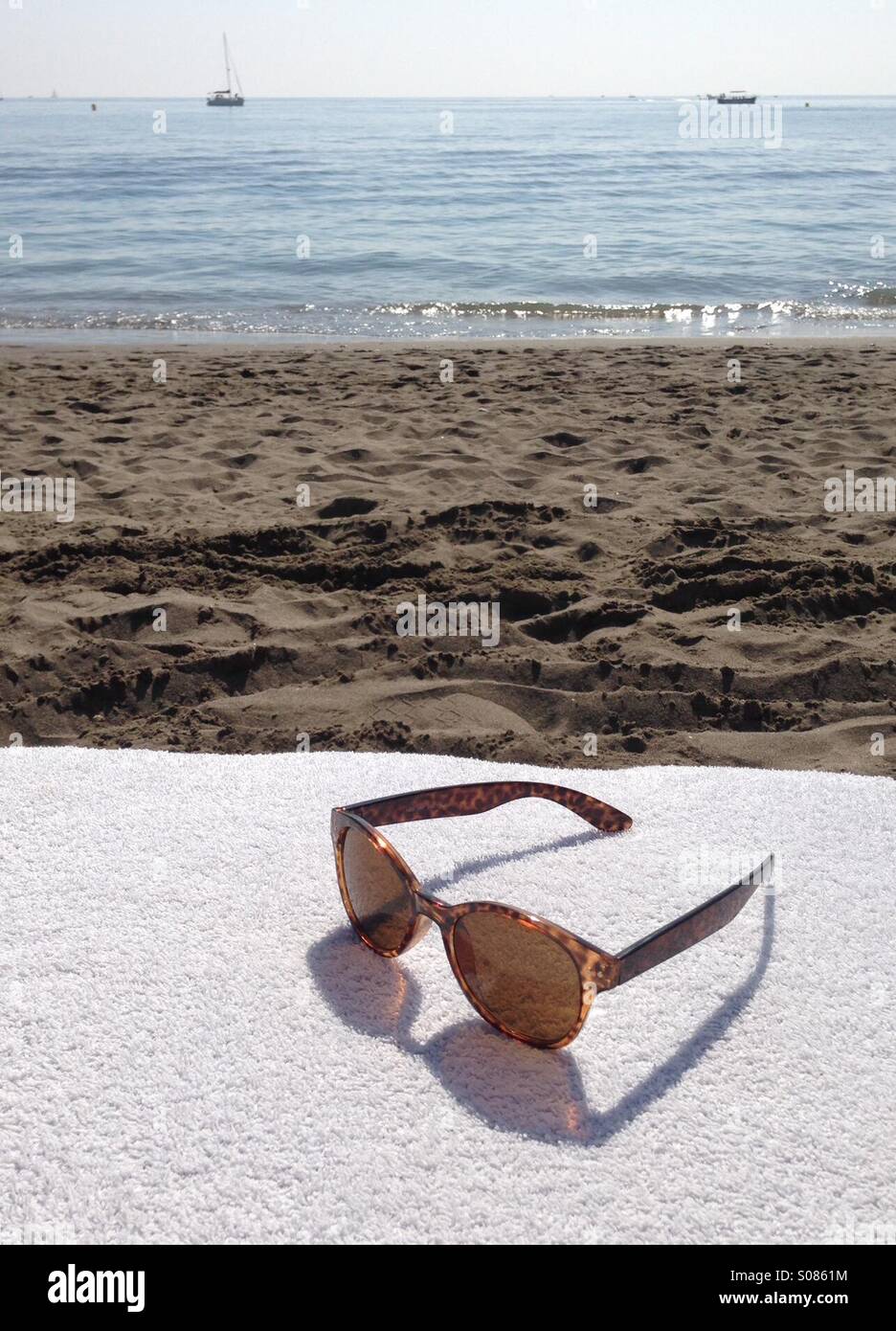 Sunglasses on the beach Stock Photo Alamy
