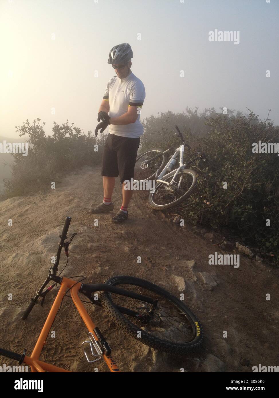 Mountain biker during a sunrise ride at Laguna beach in California. Stock Photo