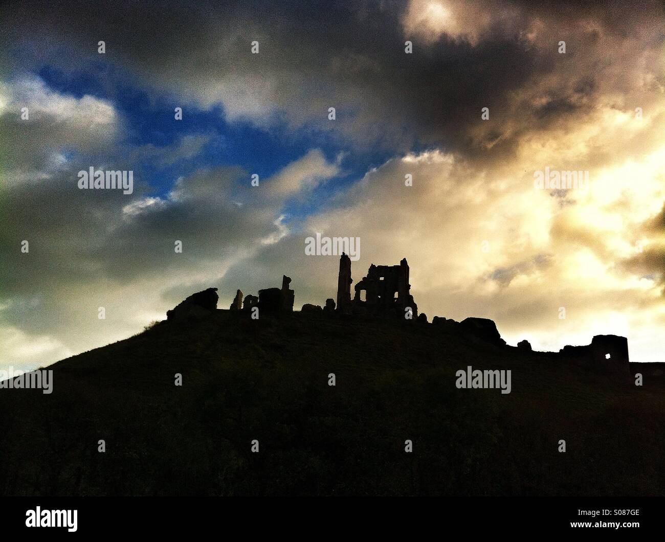 Stormy sunset over corfe castle Stock Photo