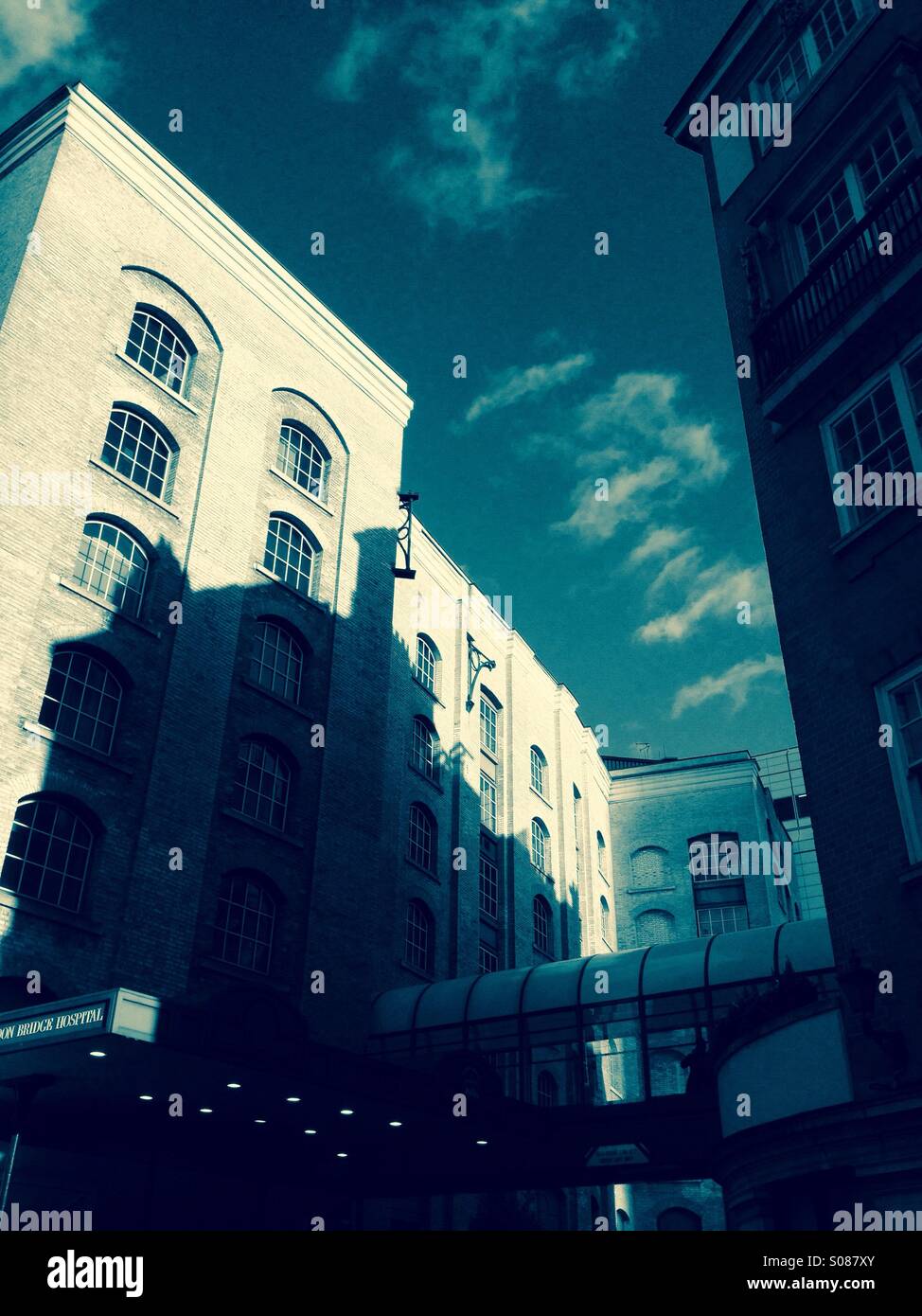 Old building shadow, blue autumn sky - Smartphone Captured Stock Image