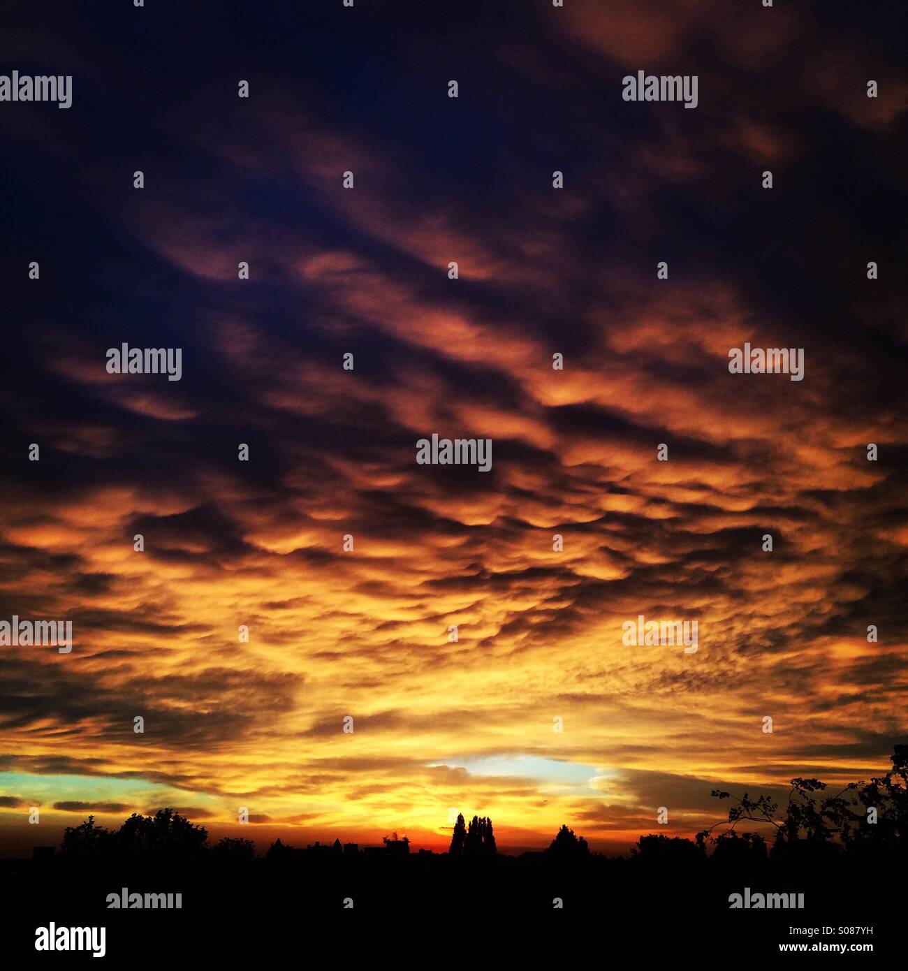 Aggressive sunset over Amsterdam Stock Photo - Alamy