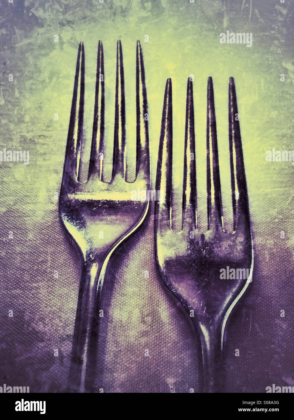 Two forks at a table setting Stock Photo