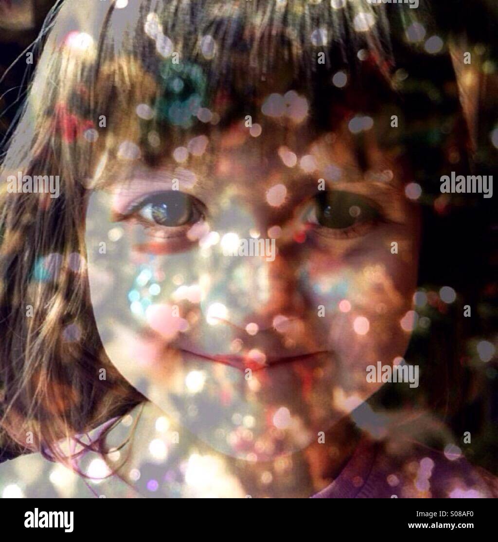 Multiple exposure toddler girl and Christmas lights Stock Photo Alamy