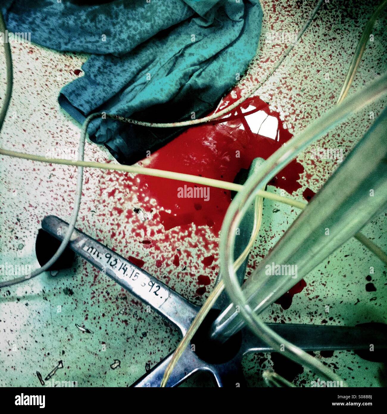 A pool of blood seen on the floor of a surgery room, during a life-saving operation of a young boy, in a state hospital in San Salvador, El Salvador, 15 December 2013. Stock Photo