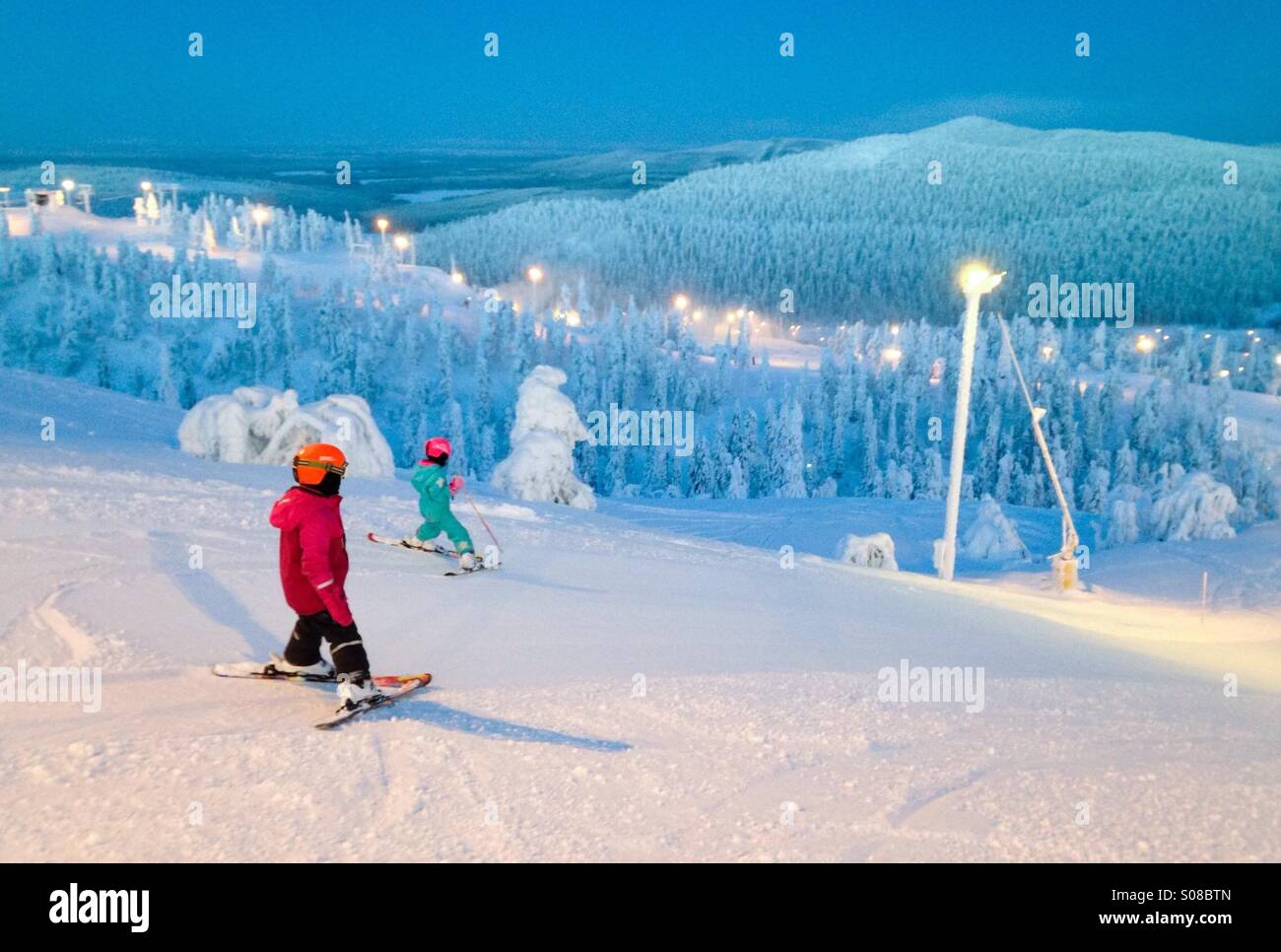 Kids skiing at Ruka ski resort, Kuusamo, Finland. MR available Stock Photo