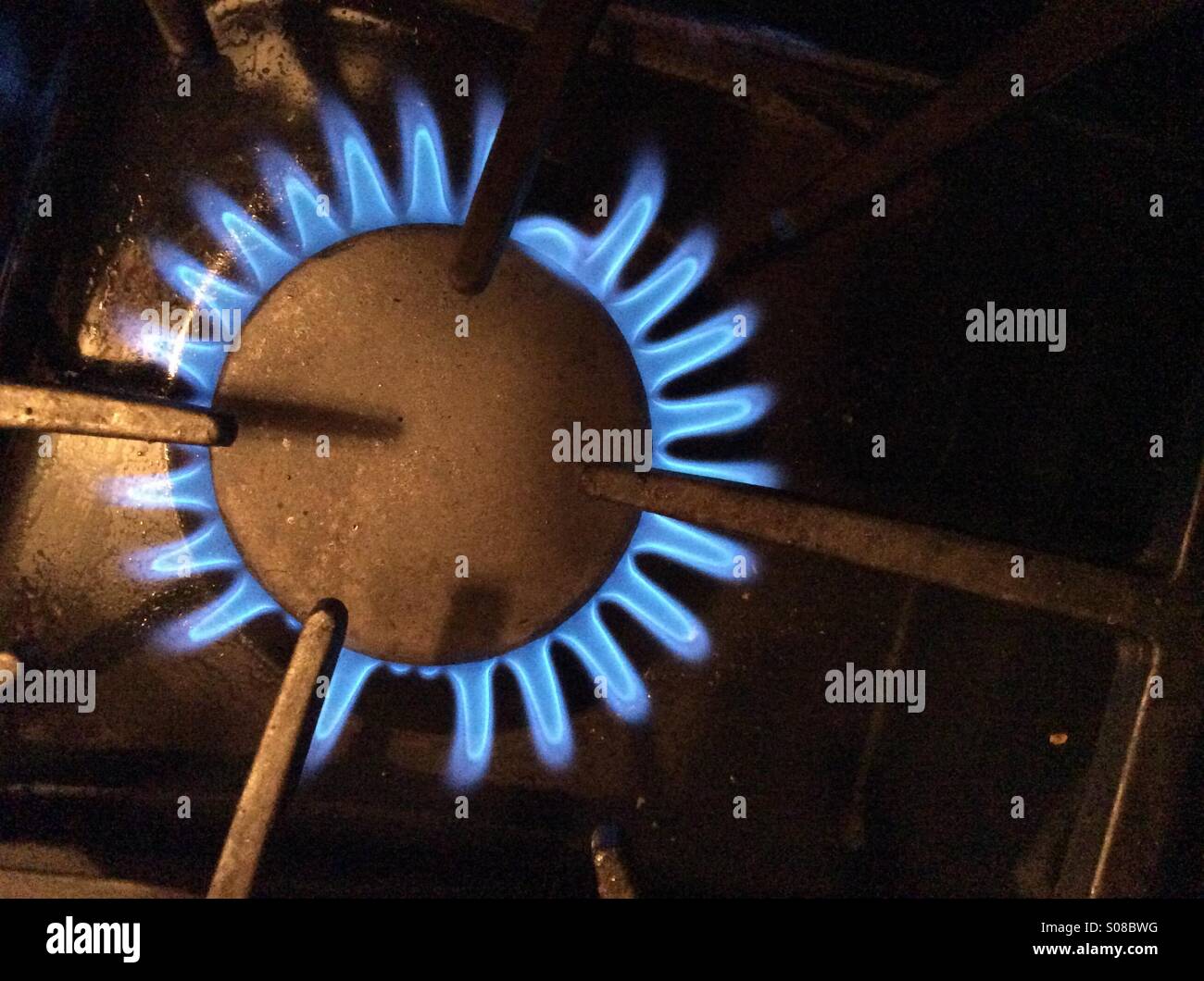 Gas stove. Open flame. No pots or pans. Ready. Cooking time. We have fire. Geometry of shapes