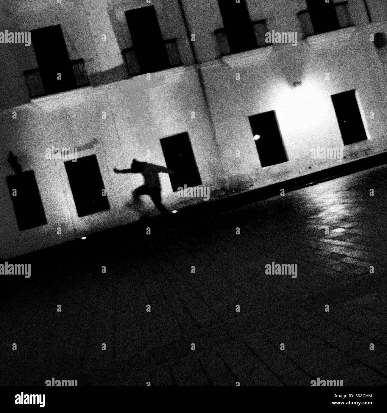 A Colombian skateboard rider jumps down the stairs in front of an old colonial house on the main plaza in Popayán, Colombia, 30 March 2014. Stock Photo