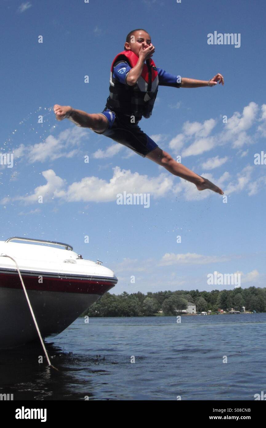 Jumping off boat Stock Photo Alamy