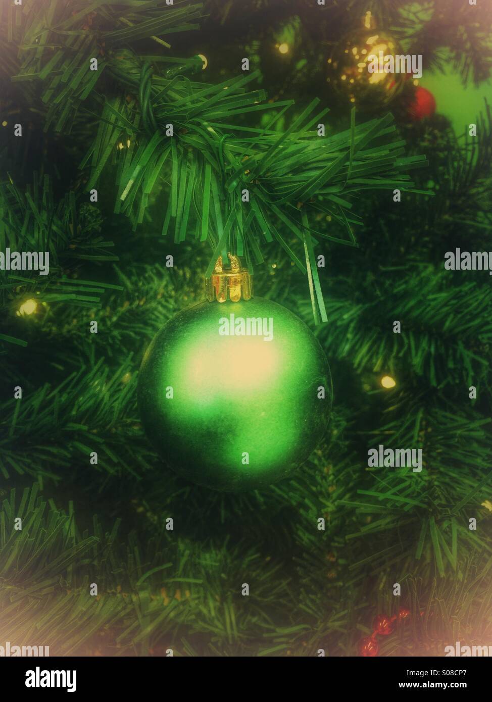 Green bauble on a Christmas tree Stock Photo Alamy
