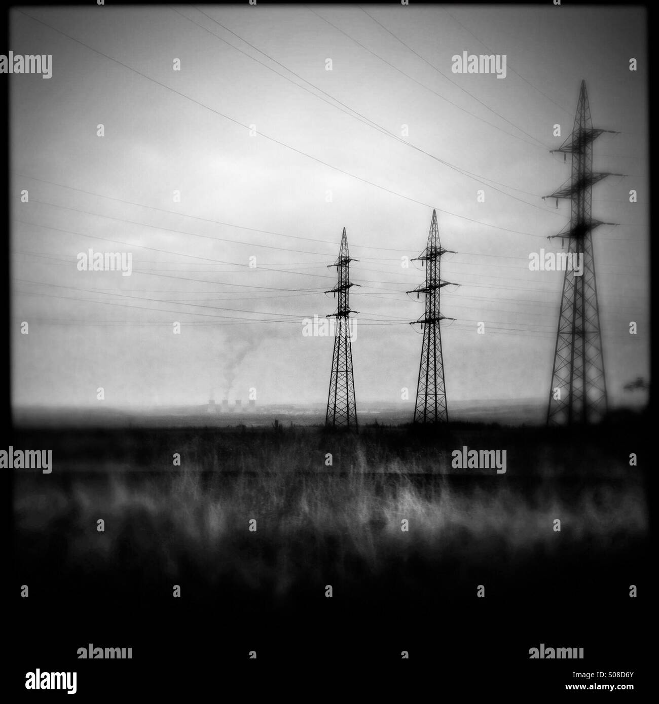 Electric towers seen from the train passing through the industrial area in the north of the Czech Republic, 4 September 2013. Stock Photo
