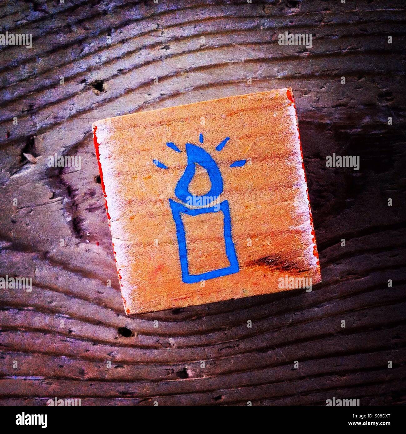 Candle drawed on a wood block - Smartphone Captured Stock Image