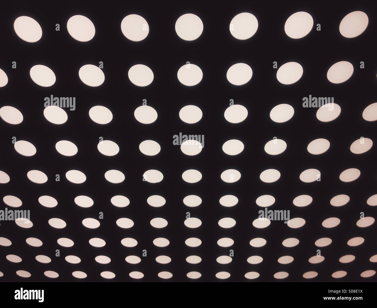 Ceiling of an elevator detail, spotty pattern made by lights. - Smartphone Captured Stock Image