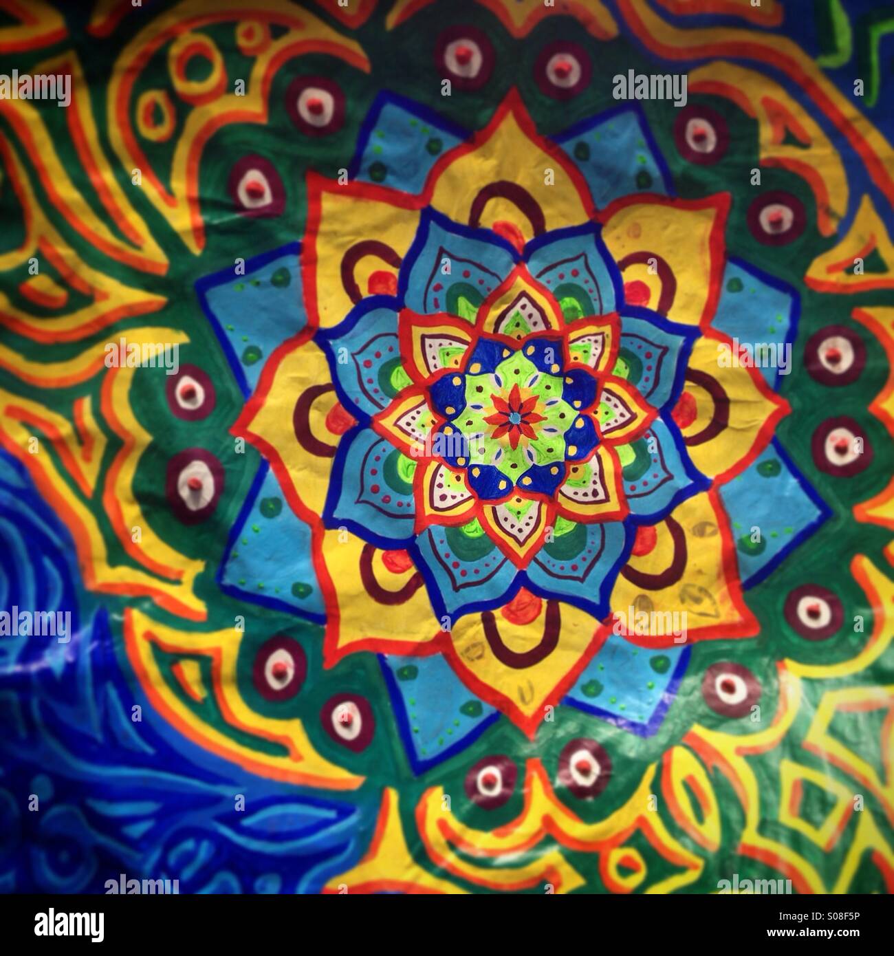 A mandala flower painted on an alebrije during the Parade of Alebrijes Monumentales in Reforma Avenue, Mexico City, Mexico. - Smartphone Captured Stock Image