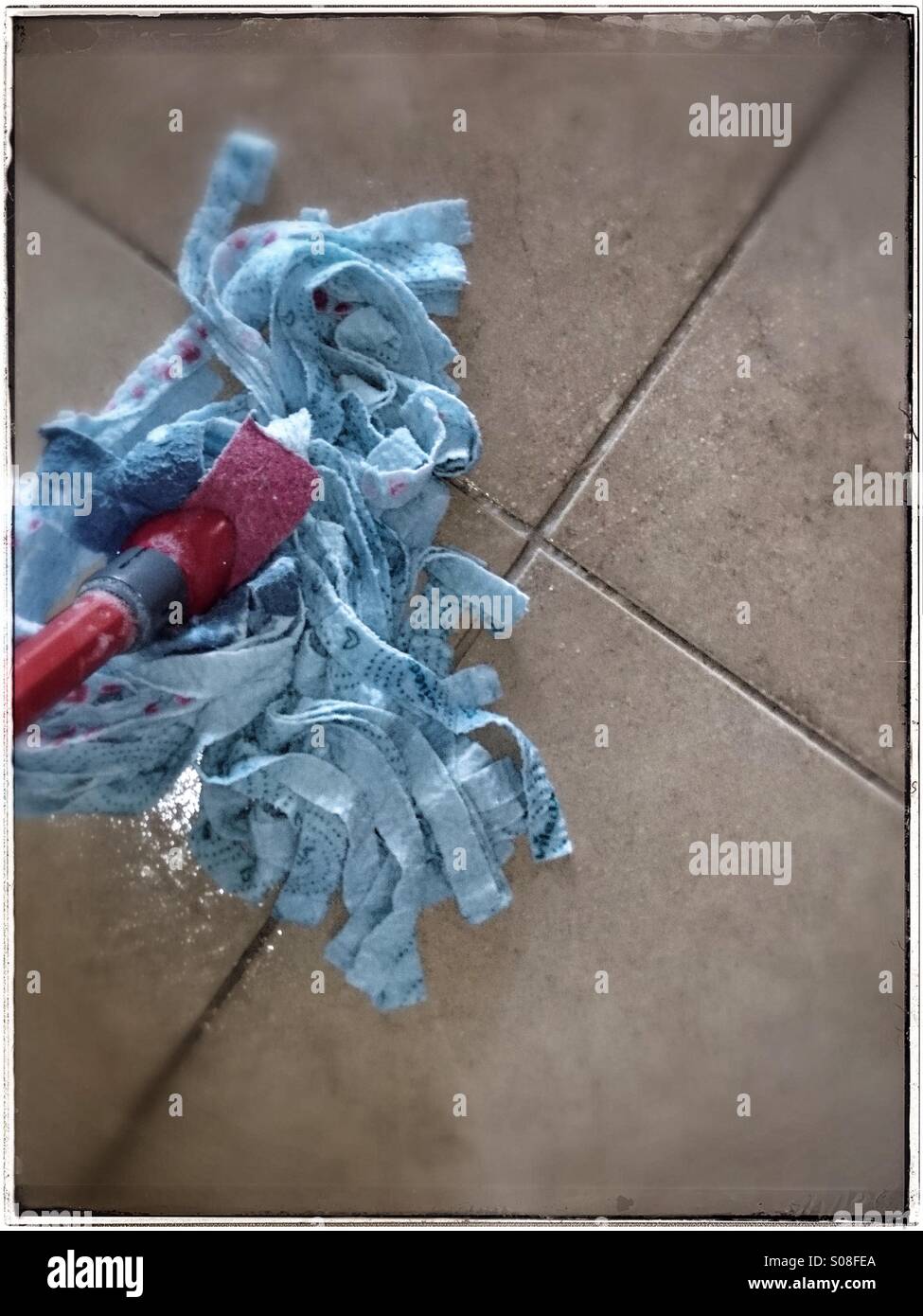 Mopping dirty floor Stock Photo