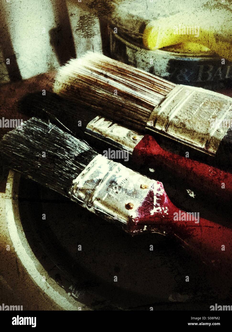 Paintbrushes on top of can of paint - Smartphone Captured Stock Image