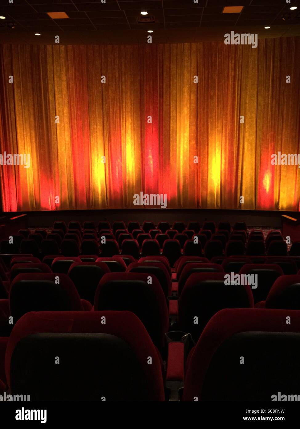 The curtain of a movie theater before the film starts Stock Photo