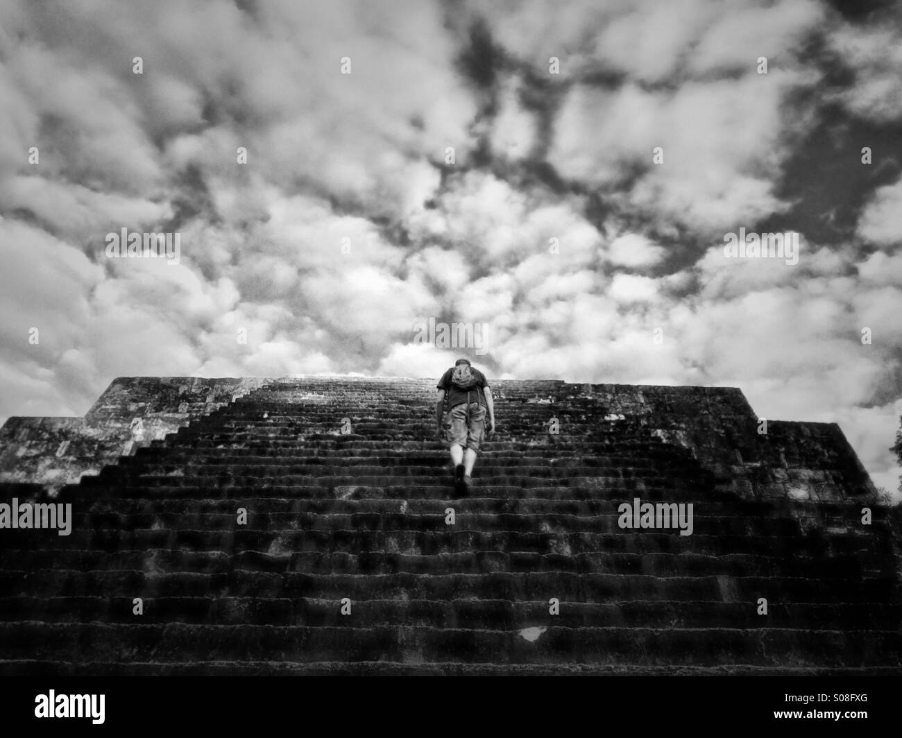 Man climbing pyramid at Tikal, Guatemala Stock Photo Alamy