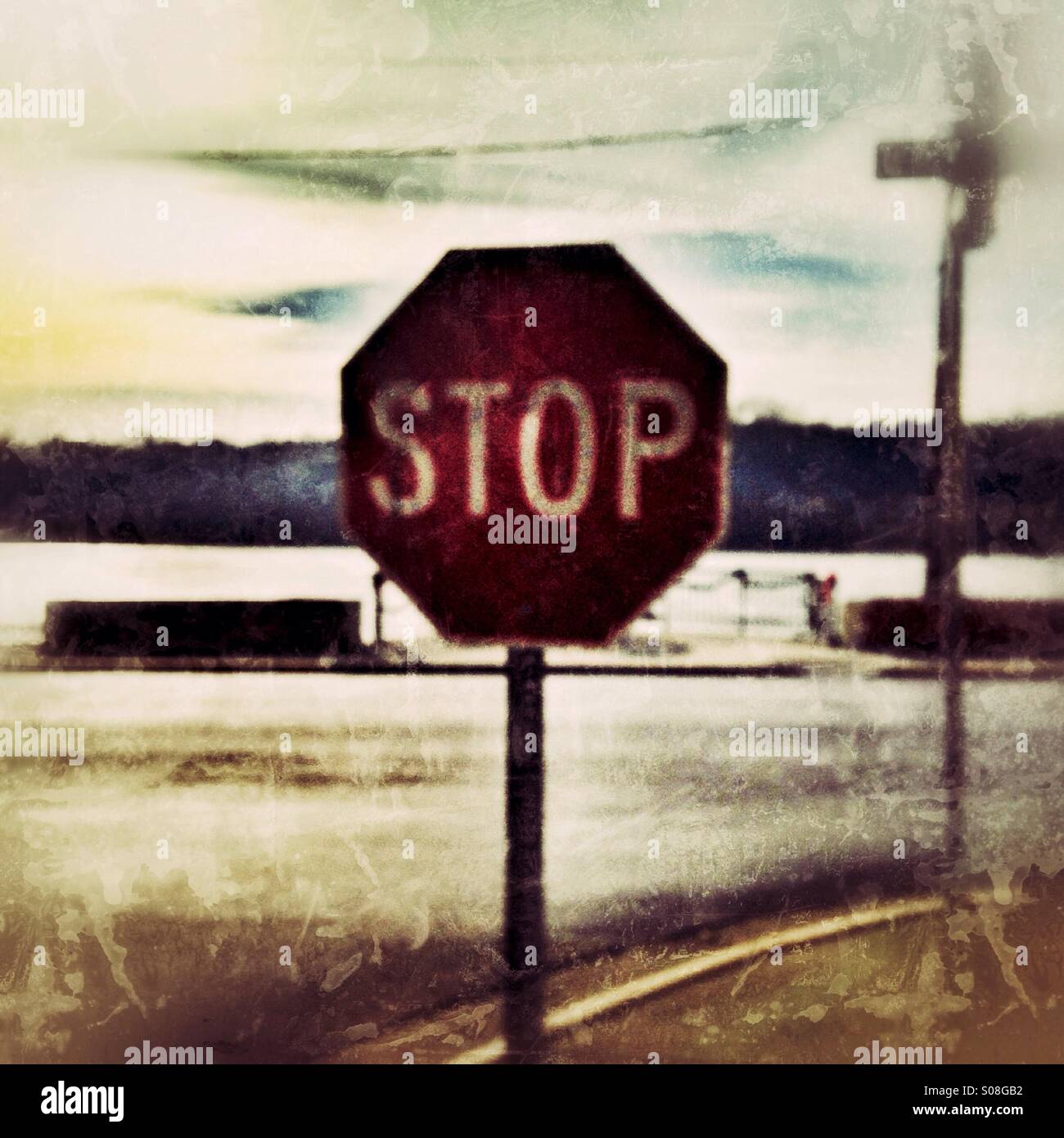 A stop sign with a river in the background. Stock Photo
