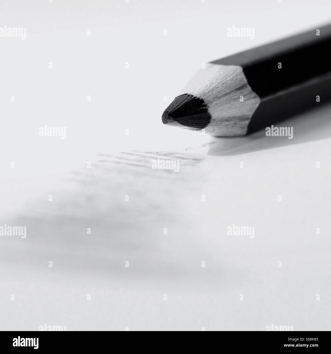 Drawing pencil lies on paper next to scribble - Smartphone Captured Stock Image