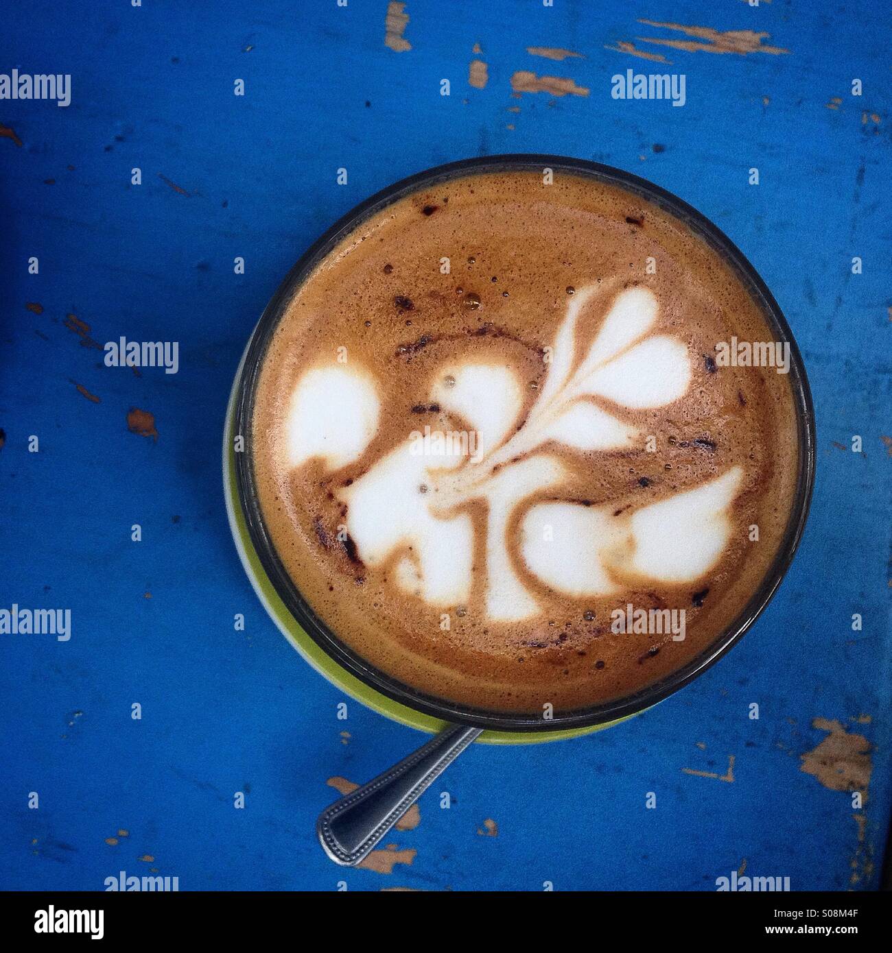 A white bird decorates a expresso coffee cup in Rococo cafe, Parque España, Colonia Condesa, Mexico City, Mexico - Smartphone Captured Stock Image