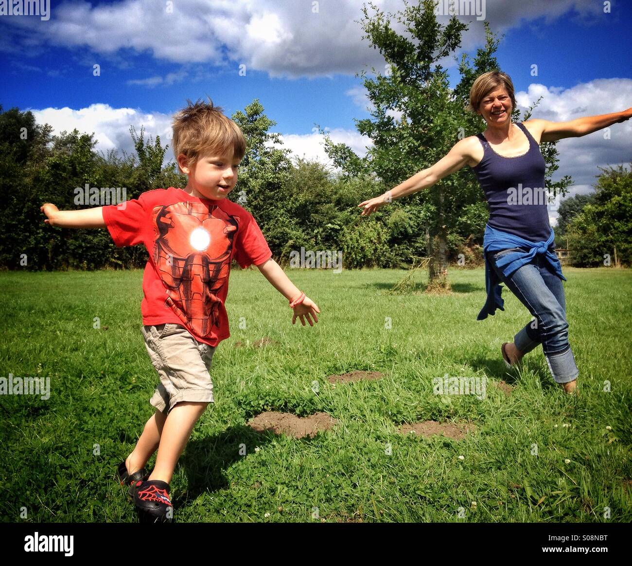 Playing aeroplanes in the sun Stock Photo