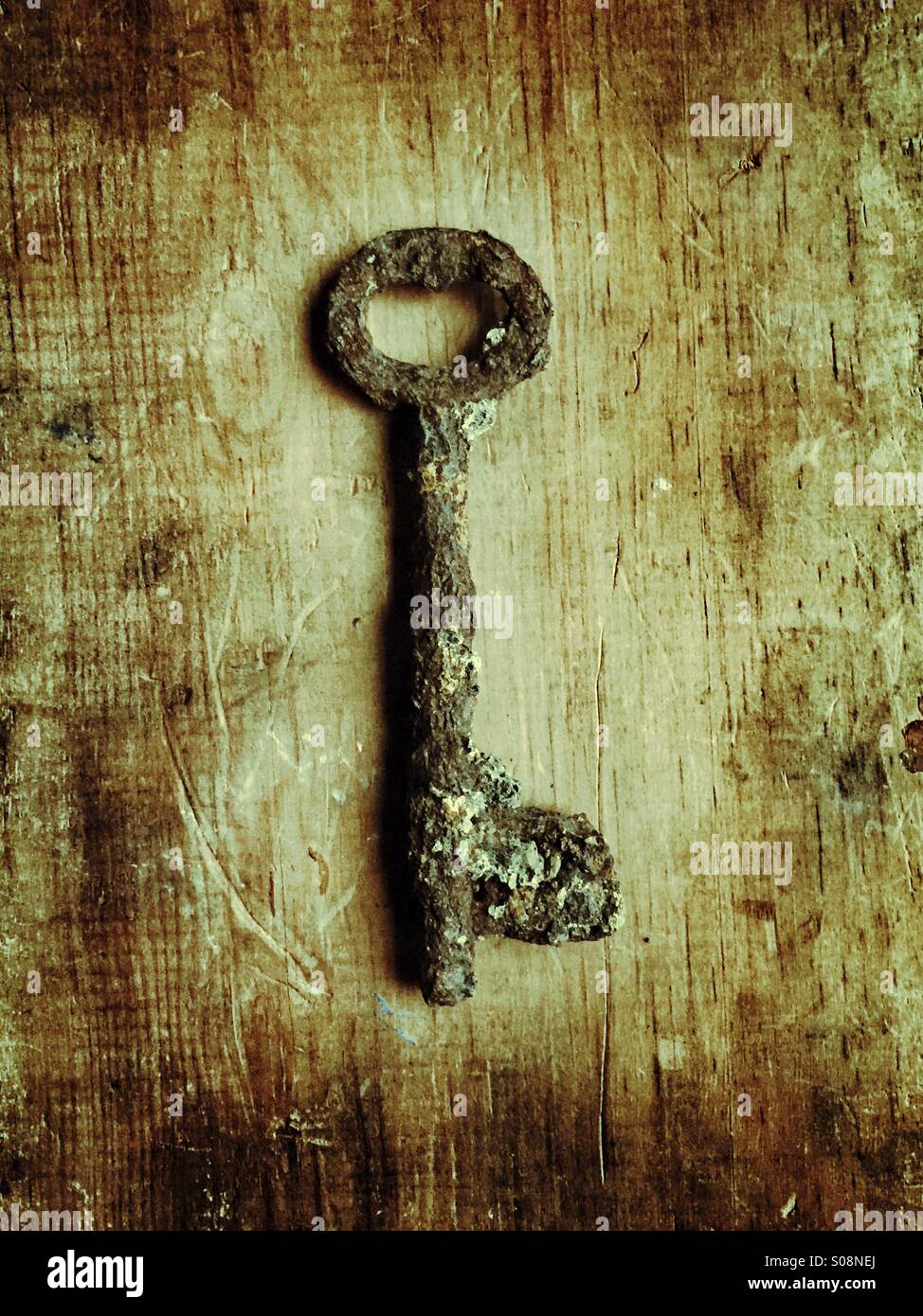 Decayed Rusty key Stock Photo