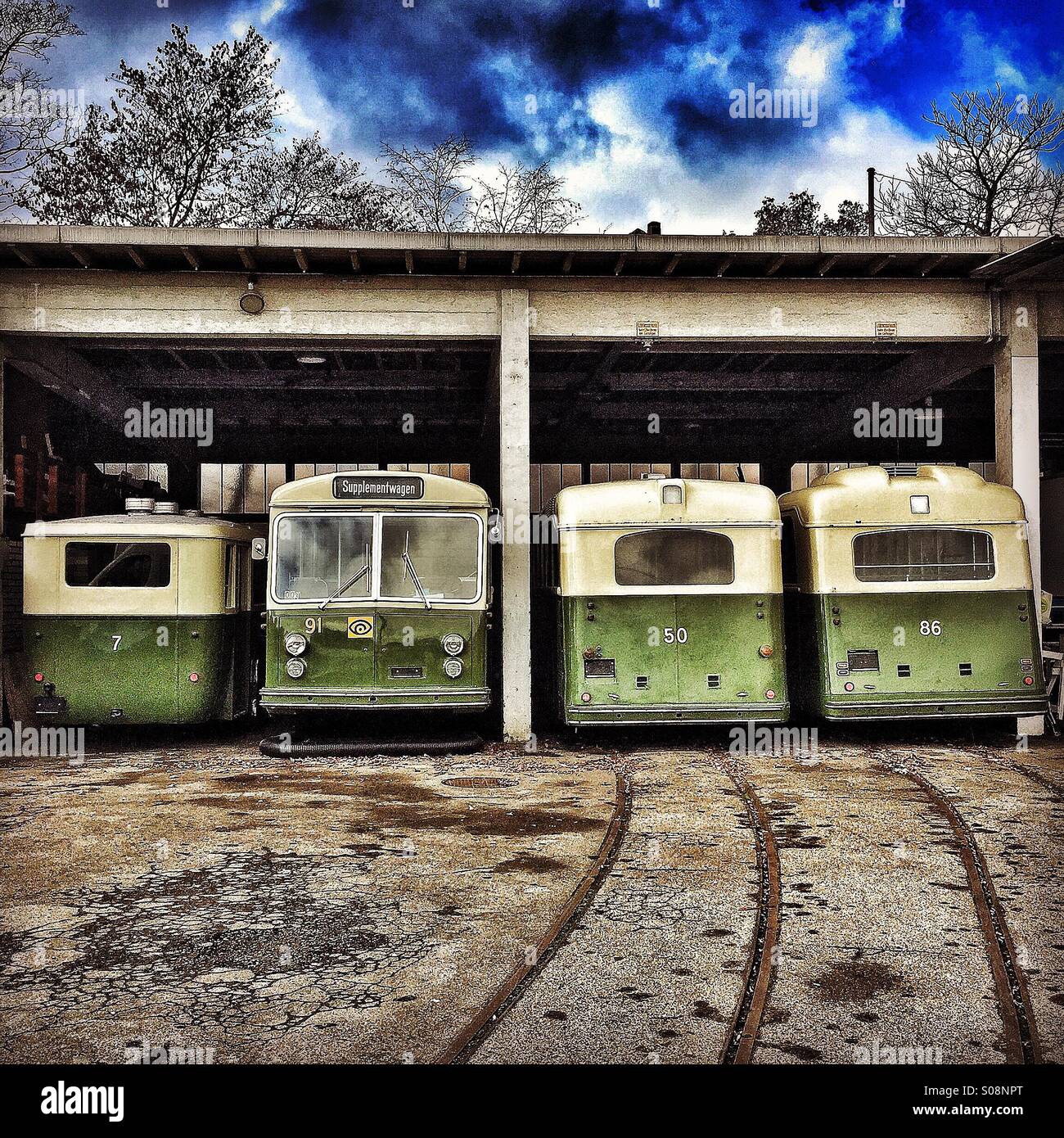 Four vintage buses in a bus garage, Bern, Switzerland Stock Photo - Alamy