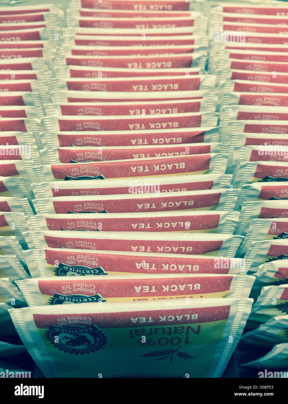 Upside down rows of black tea packets - Smartphone Captured Stock Image