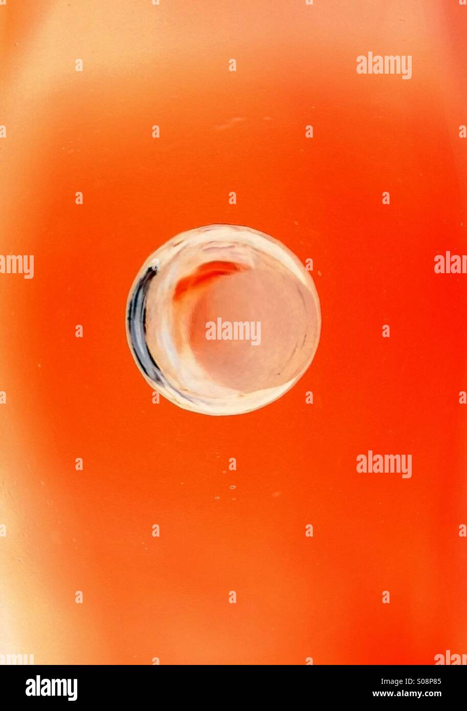 Water drop on orange background Stock Photo