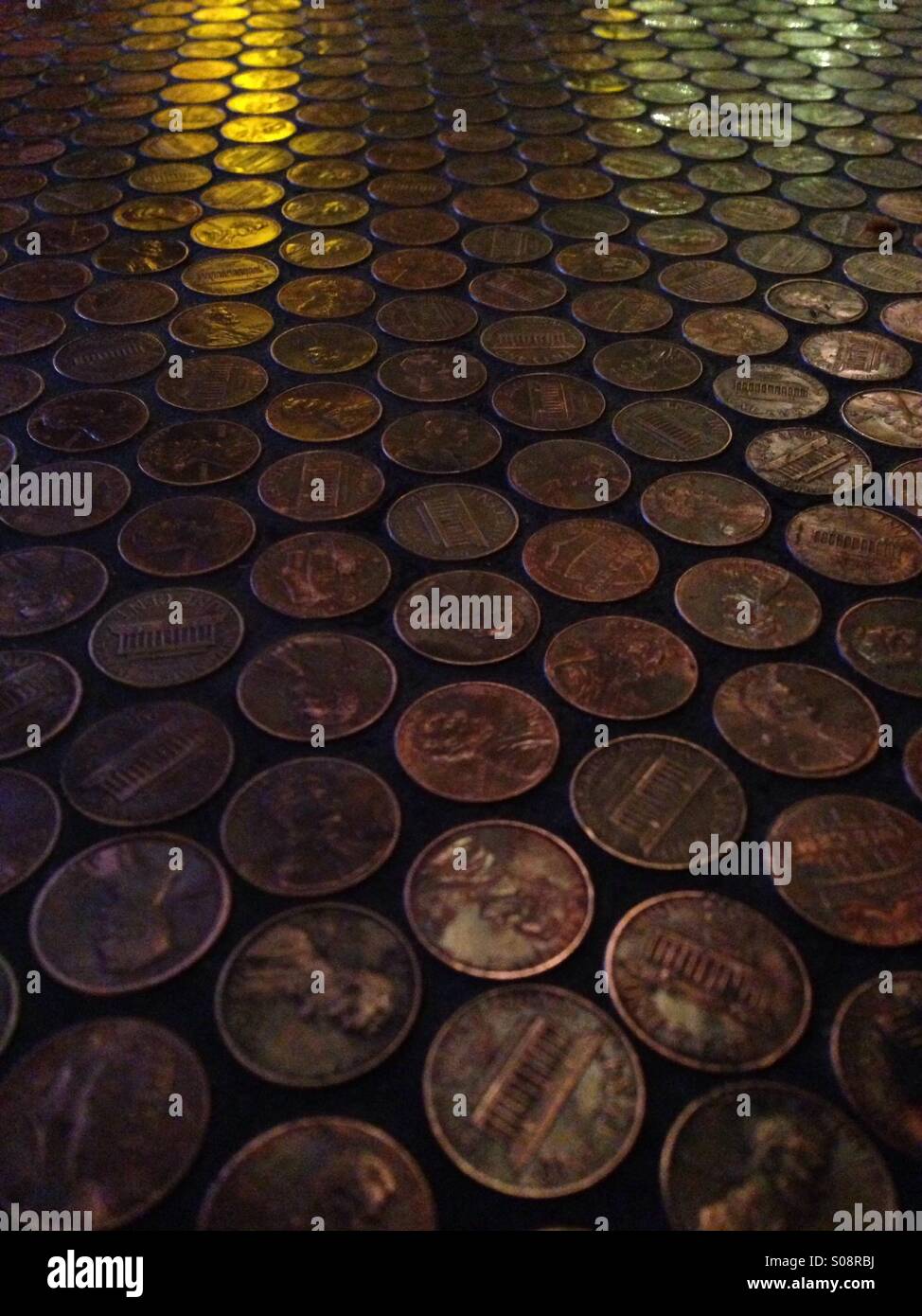 Pennies on a bar. - Smartphone Captured Stock Image
