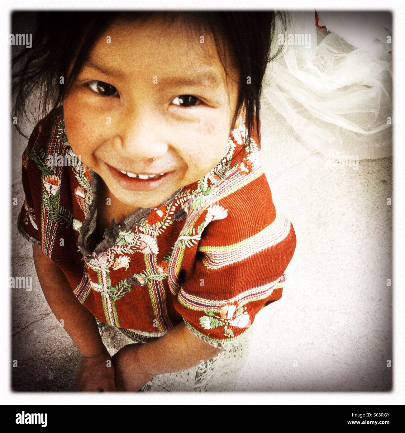 A maya indigenous girl in Tierra Linda, a Mayan village near lake Atitlan, Solola, Guatemala. Stock Photo