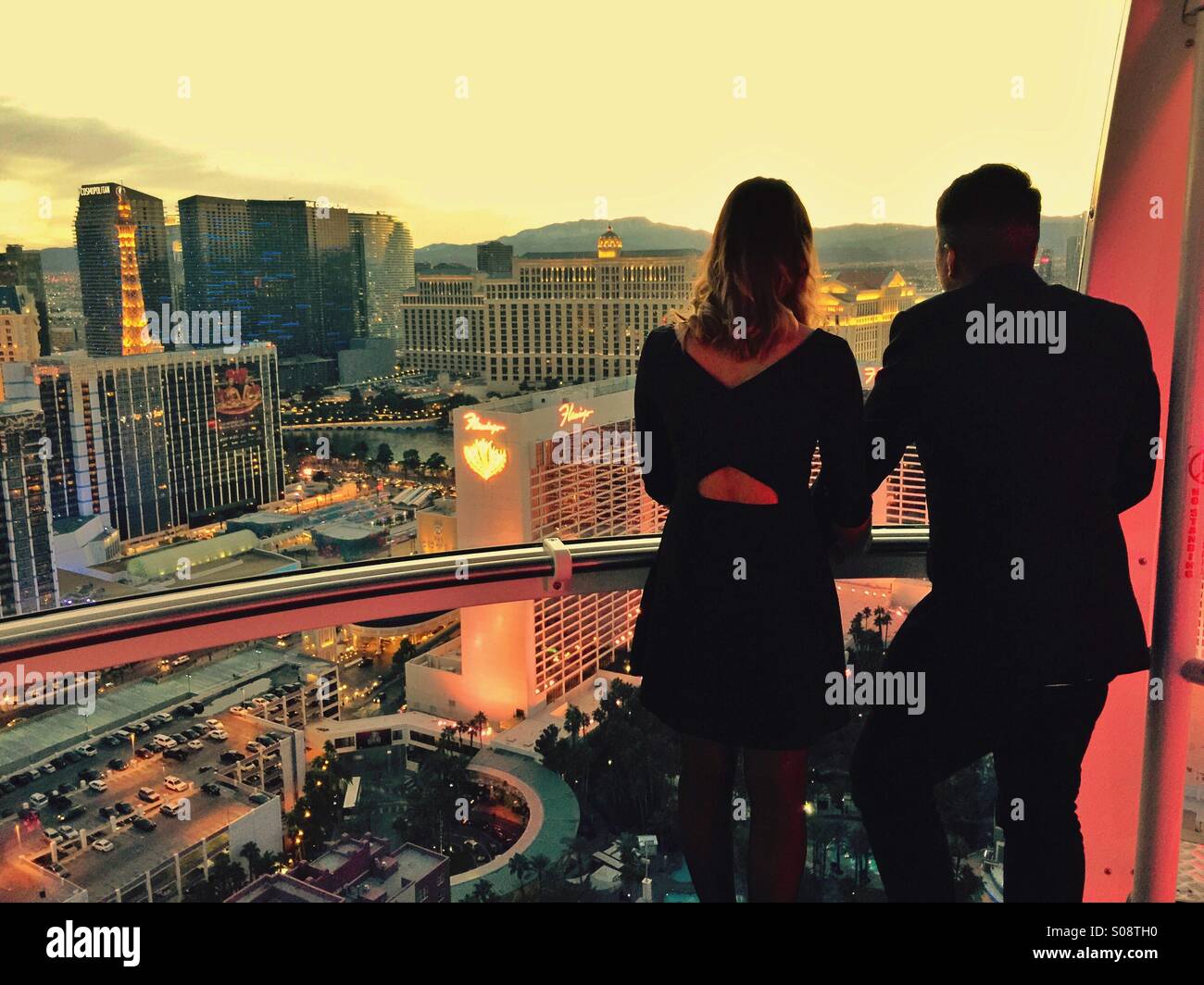 Couple of people in the giant high roller Linq Ferris wheel above Las Vegas Nevada Stock Photo