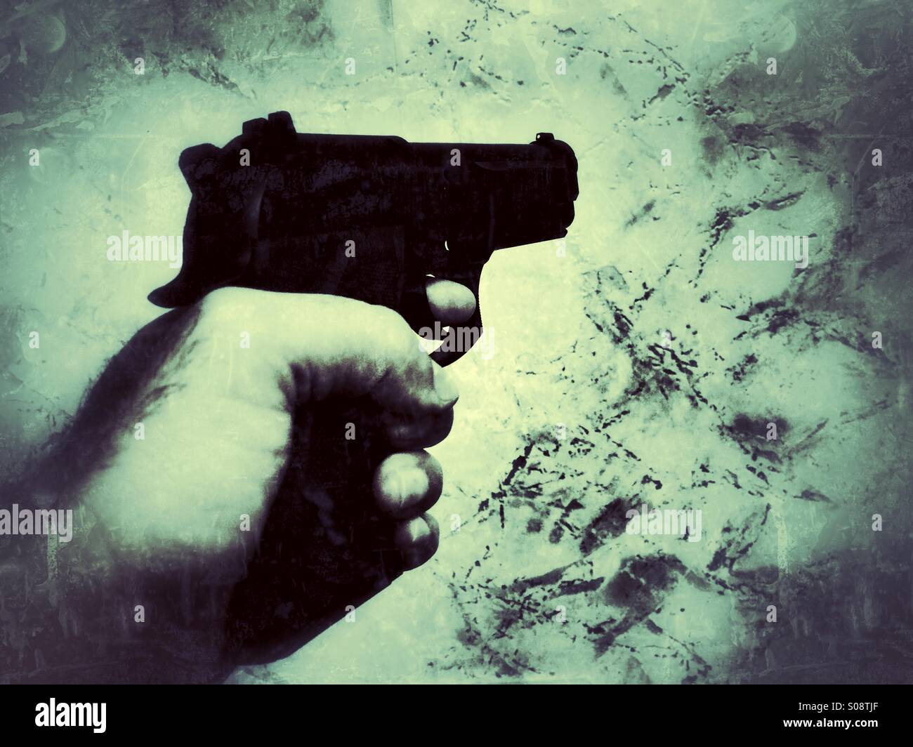 Man shooting with a gun Stock Photo