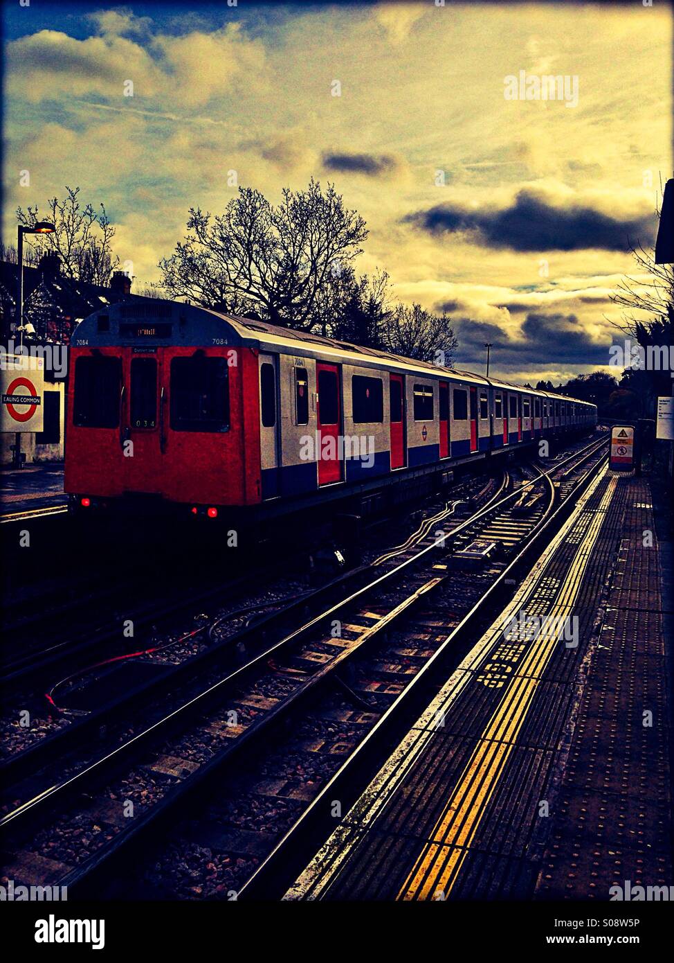 Tube train at Ealing Common, London, UK Stock Photo