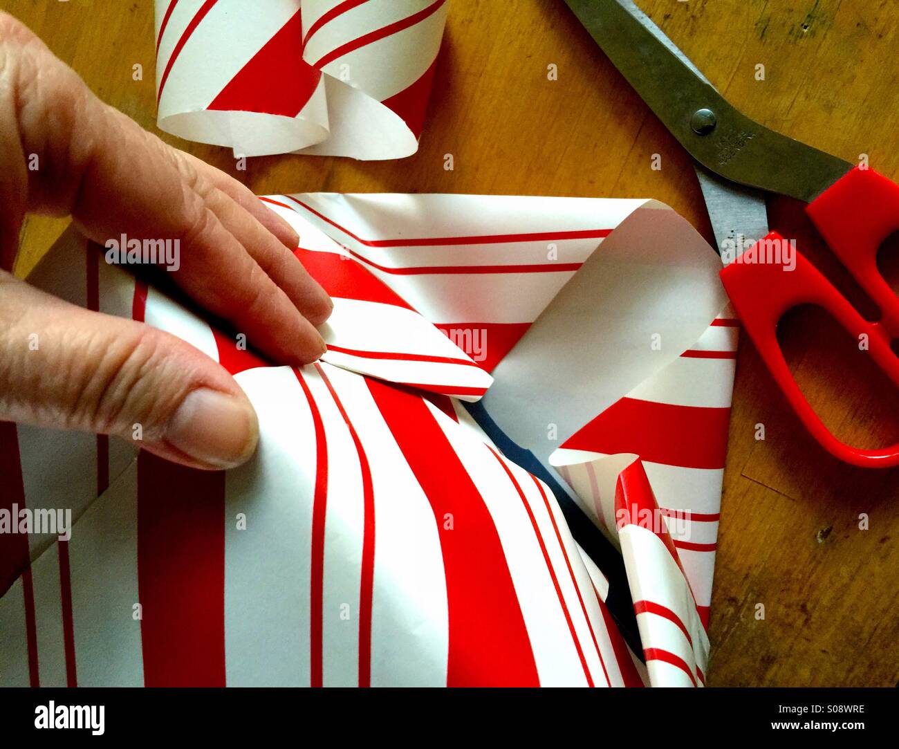 Wrapping Christmas present - Smartphone Captured Stock Image
