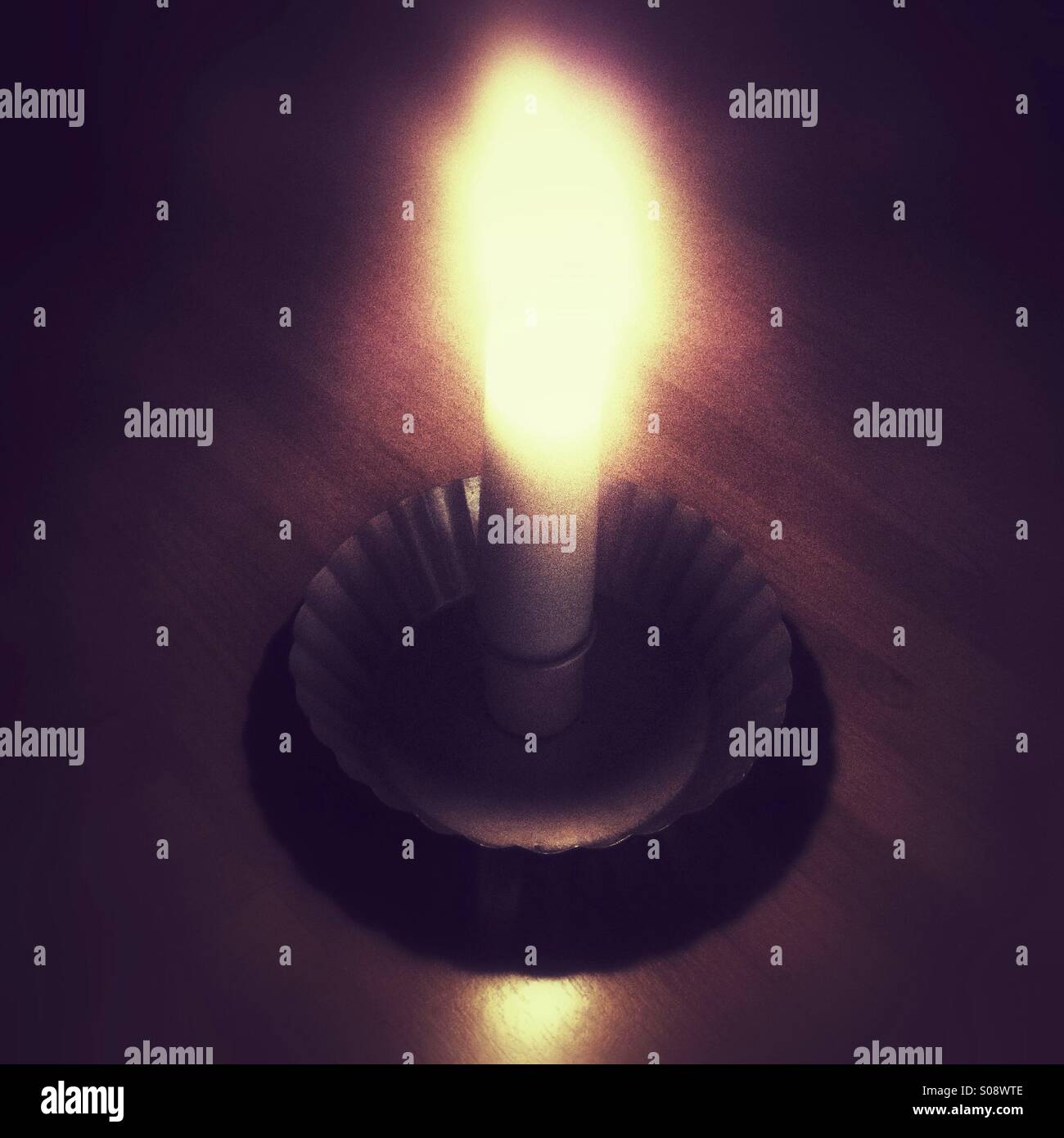 Wax candle and candlestick holder - Smartphone Captured Stock Image