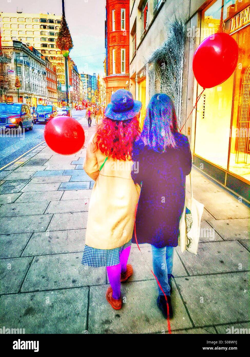 Two young woman with Red balloons - Smartphone Captured Stock Image
