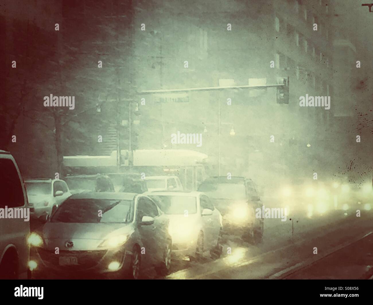 Traffic during a snow storm at 18th and California Street in Denver, Colorado - Smartphone Captured Stock Image
