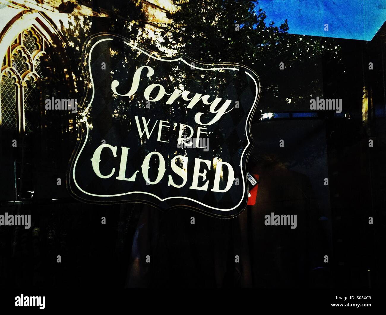 Sorry we're closed sign on door England UK Stock Photo