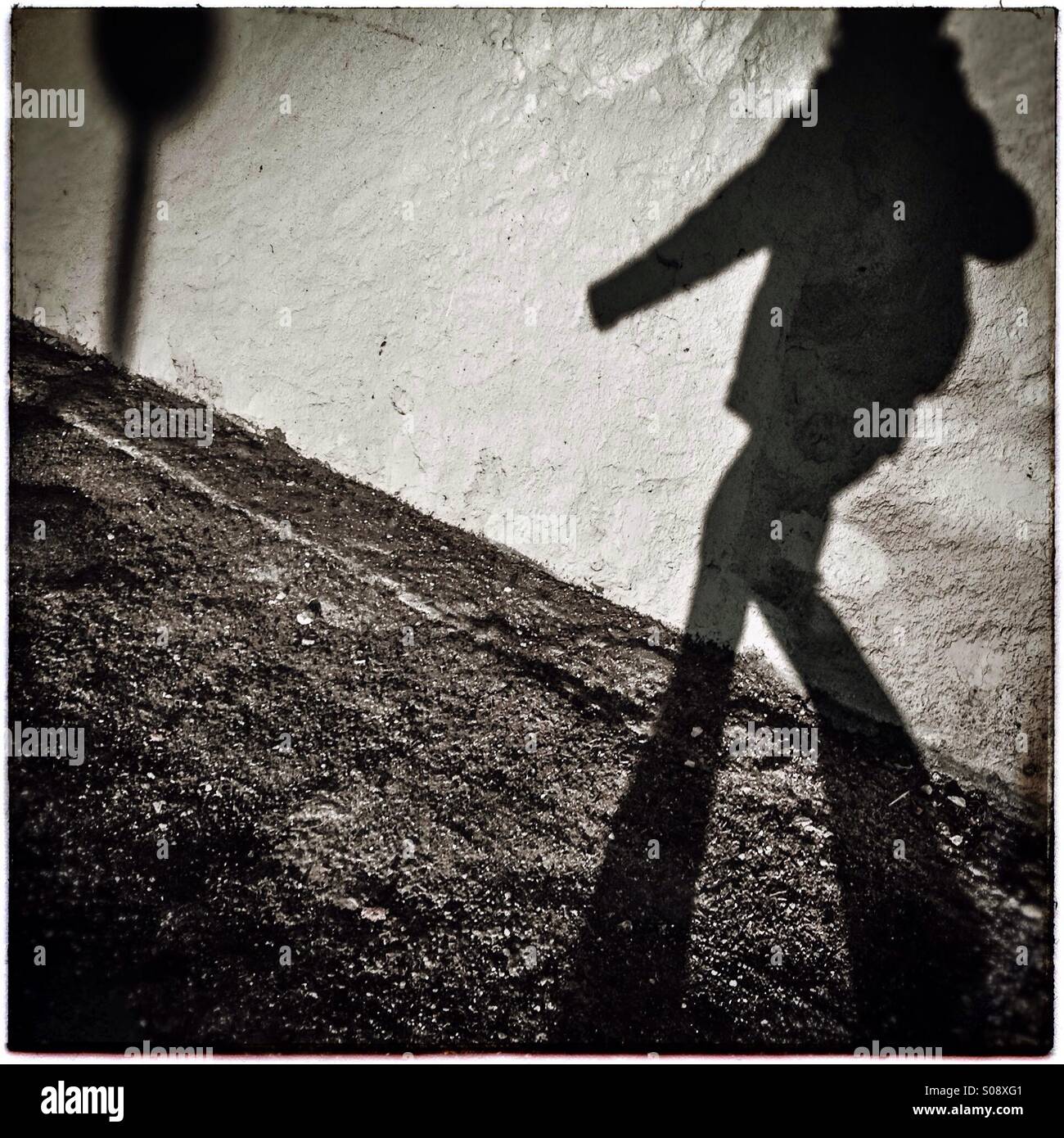 Shadow of a pedestrian walking on the street - Smartphone Captured Stock Image