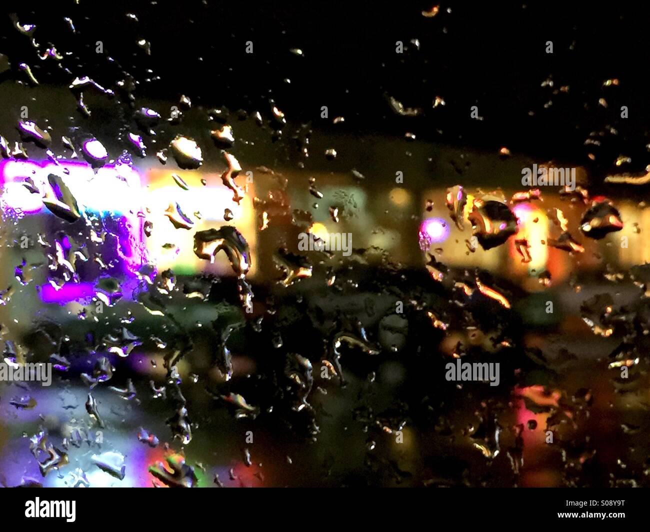 Shops from car in rain Stock Photo