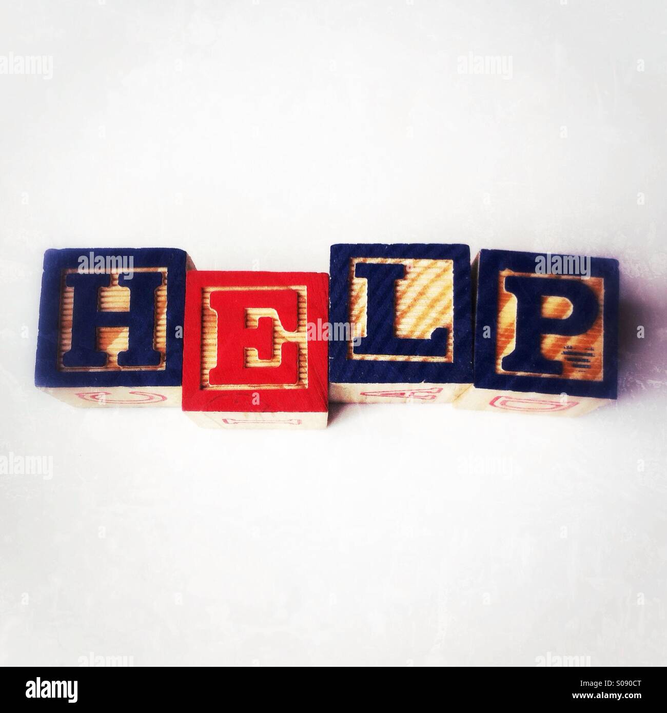 Help written in wooden alphabet blocks - Smartphone Captured Stock Image