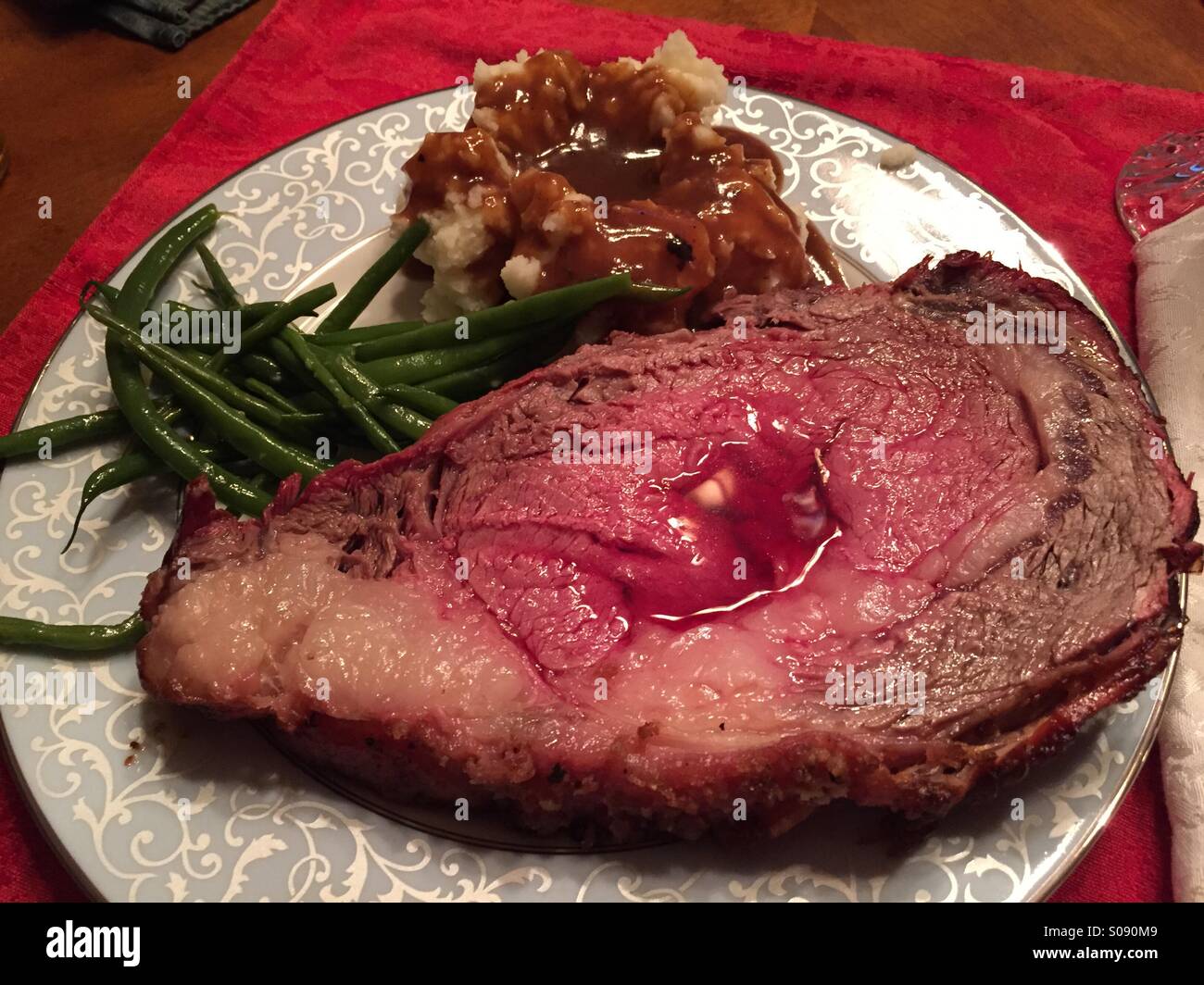 Christmas dinner plate: prime rib roast with au jus. Stock Photo