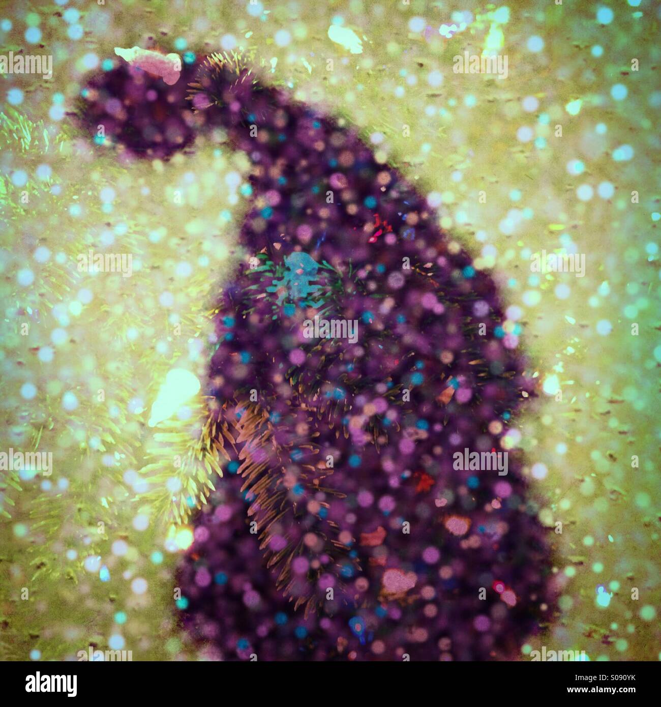 Double exposure of my shadow wearing a Santa hat blended with a Christmas tree. - Smartphone Captured Stock Image