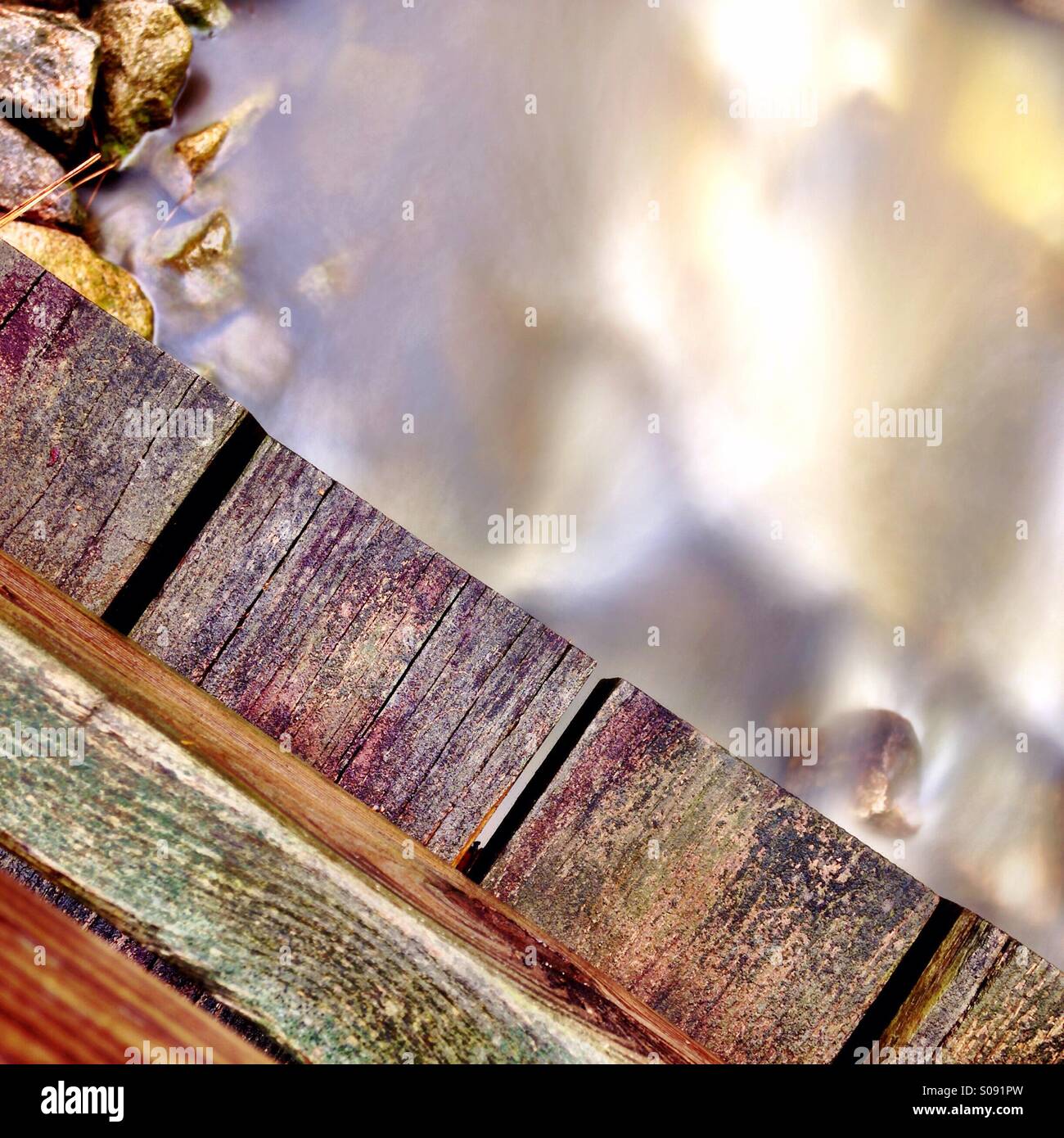 Bridge over a stream Stock Photo - Alamy
