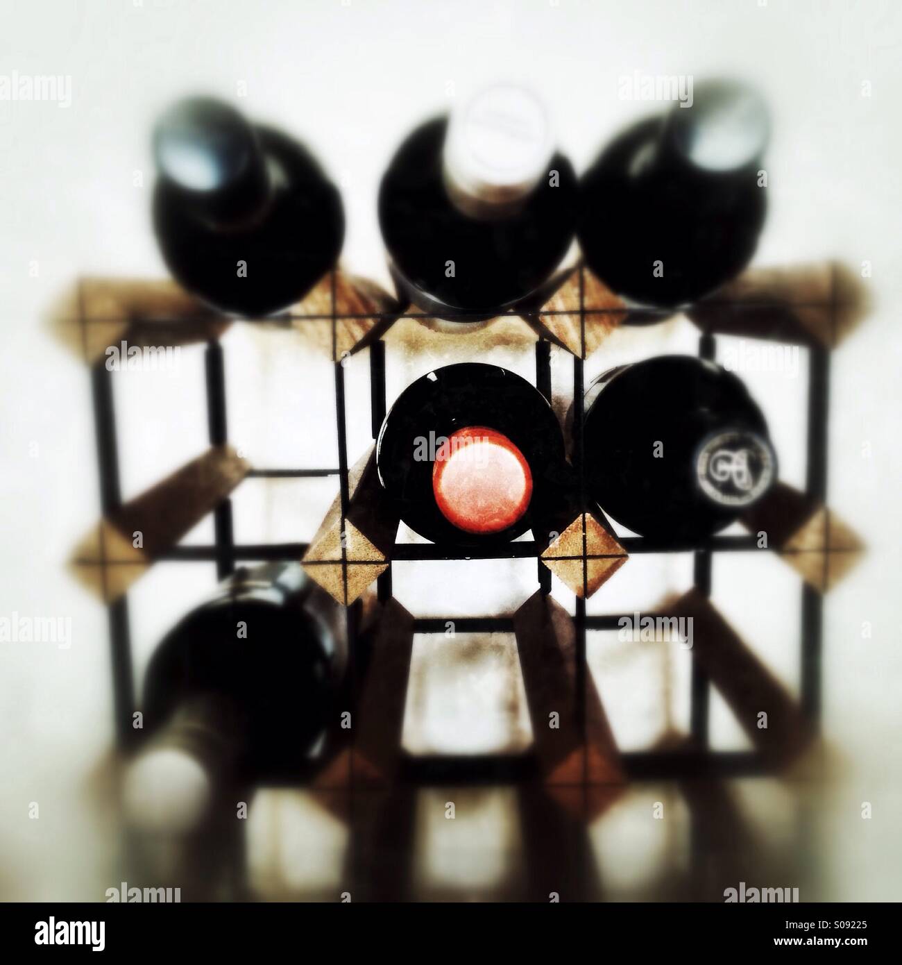 Vine bottles on a rack. - Smartphone Captured Stock Image