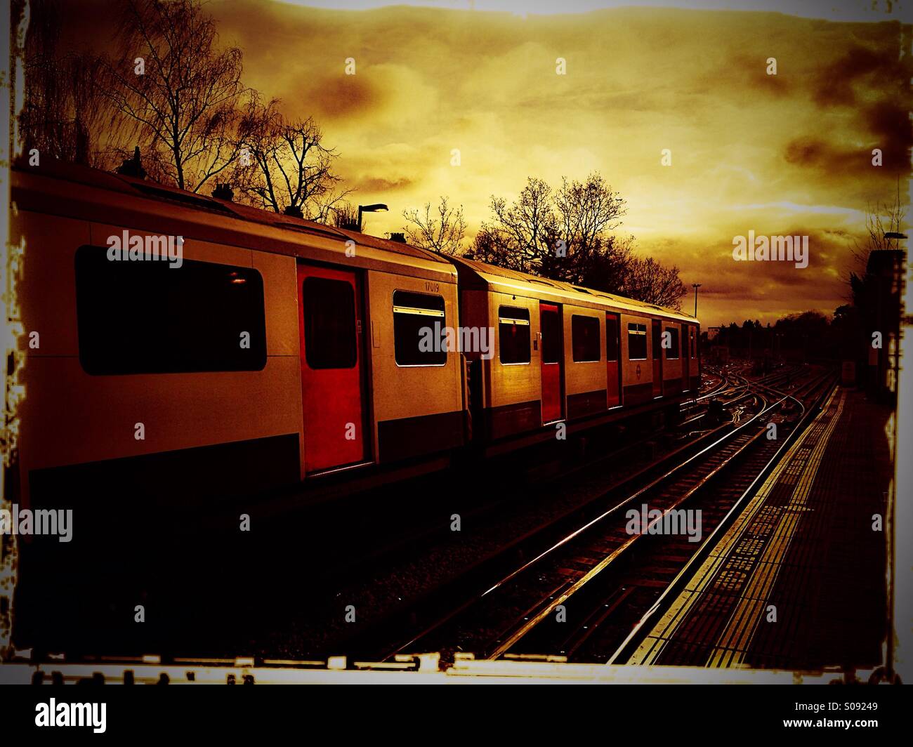 Tube train in transit, Ealing Common, London, UK Stock Photo