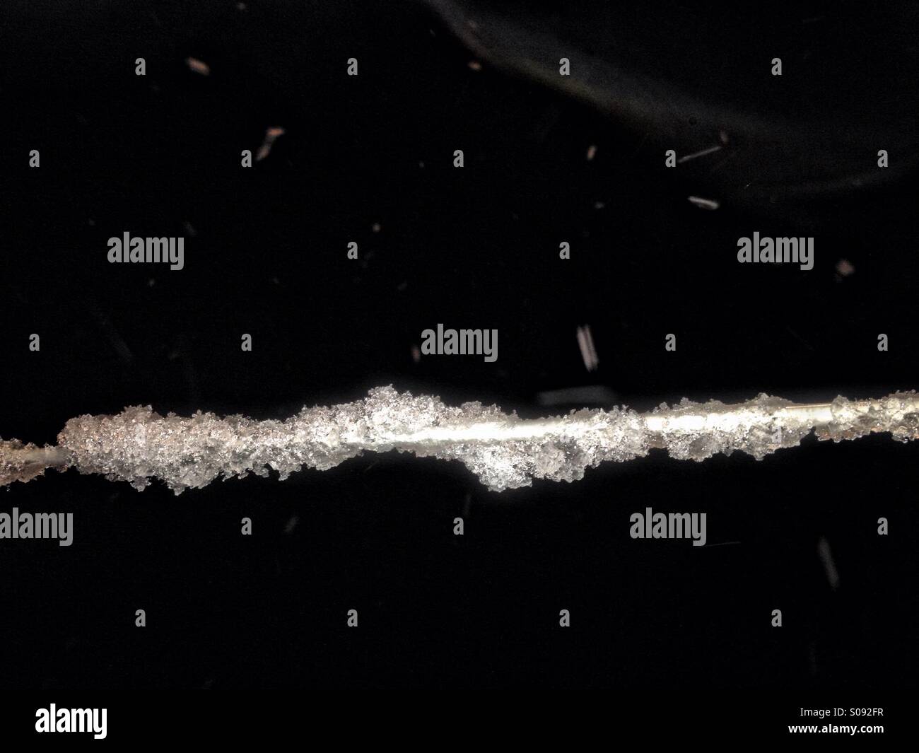 Snow on washing line - Smartphone Captured Stock Image